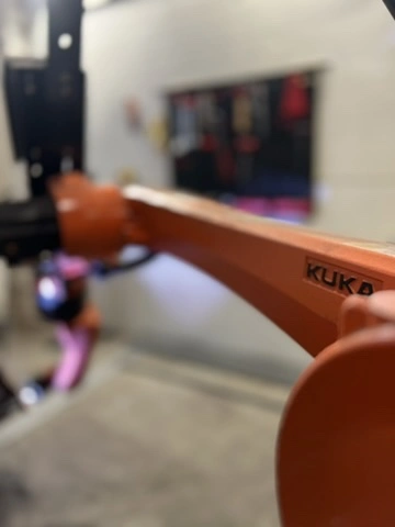 Industrial KUKA robotic welding arm used in metalworking project